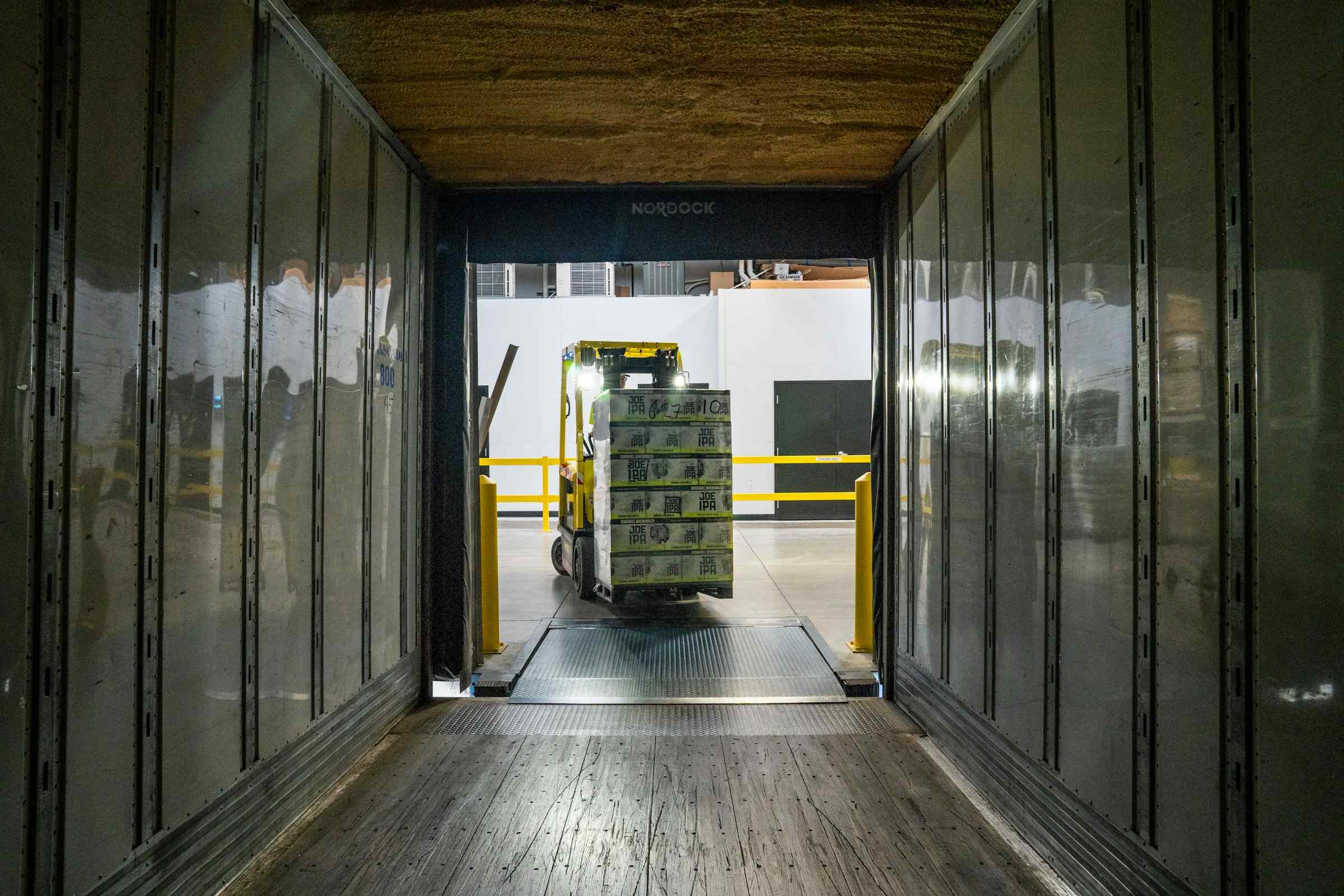 Forklift driver loading trailer